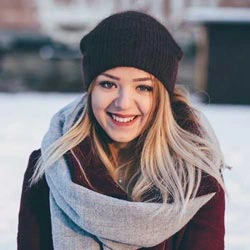 A Girl in Cool Place Wear a Cap and Muffler